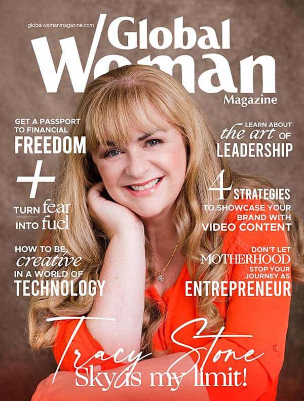 caucasian-blonde-female-entrepreneur-coach-magazine-cover-photo-shoot-in-orange-blouse-smiling-into-camera